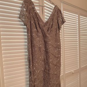 Beautiful dress worn once by Mother of the Bride. Very comfortable and elegant.